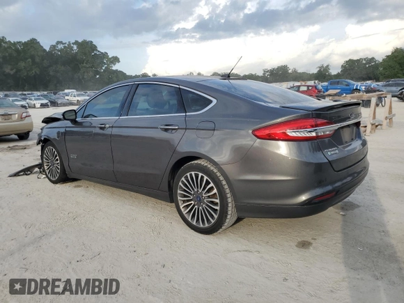 2017 Ford Fusion Titanium z VIN 3FA6P0SU0HR290201, wystawiony jako Copart lot #60106095 z przebiegiem 98 086 mil mil oraz Szkoda całkowita • Salvage title. Historia ofert i sprzedaży dostępna na DreamBid. Obrazek 2.