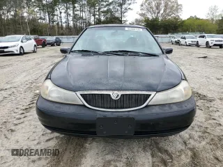 1998 Mercury Mystique z VIN 1MEFM66L7WK639796, wystawiony jako Copart lot #52880105 z przebiegiem 254 649 mil mil oraz Nie do naprawy. Historia ofert i sprzedaży dostępna na DreamBid. Obrazek 5.