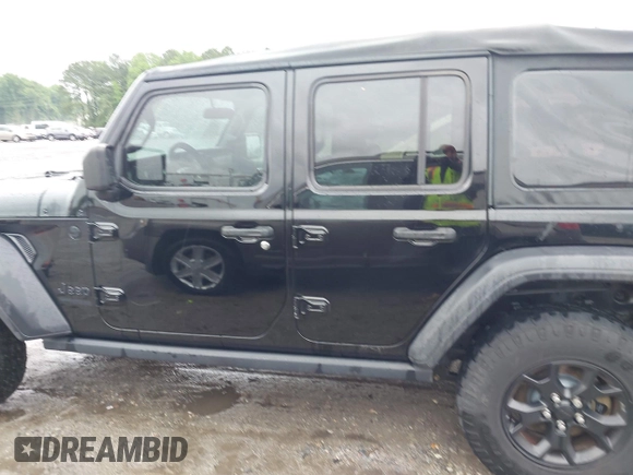 2021 Jeep Wrangler Unlimited Sport S with VIN 1C4HJXDN0MW678801, listed as a IAAI auction lot 42211815 with 96,849 mi miles and . Bid and sale history available at DreamBid. Image 14.