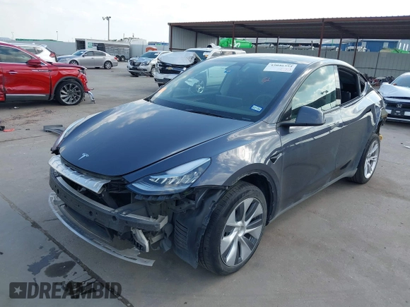 2023 Tesla Model Y Long Range with VIN 7SAYGDEEXPA078629, listed as a IAAI auction lot 42046354 with 27,245 mi miles and . Bid and sale history available at DreamBid. Image 2.