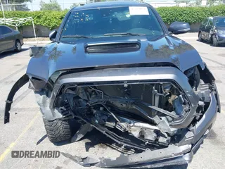 2021 Toyota Tacoma SR z VIN 5TFCZ5AN1MX274315, wystawiony jako IAAI lot #42273054 z przebiegiem 67 863 mil mil oraz . Historia ofert i sprzedaży dostępna na DreamBid. Obrazek 12.