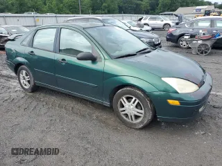 2000 Ford Focus SE with VIN 1FAFP3433YW354797, listed as a Copart auction lot 61430265 with 165,202 mi miles and Salvage title. Bid and sale history available at DreamBid. Image 4.