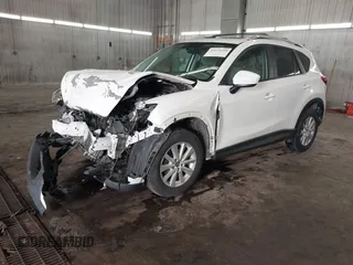 2014 Mazda CX-5 Touring with VIN JM3KE4CY4E0321055, listed as a IAAI auction lot 41613593 with 174,339 mi miles. Bid and sale history available at carsss.com. Image 2.