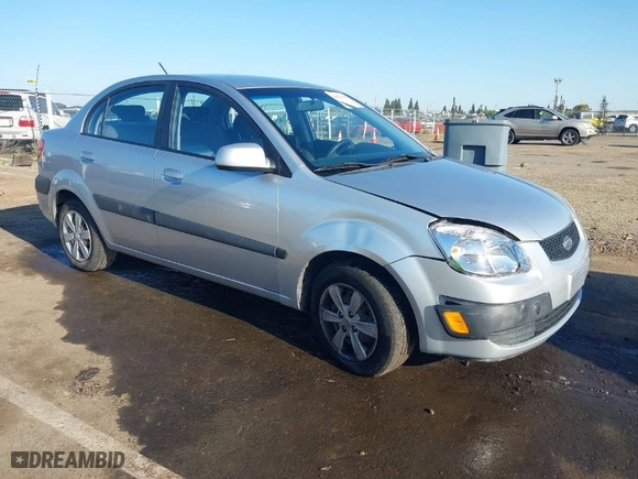 2009 Kia Rio SX with VIN KNADE223296523842, listed as a IAAI auction lot 42024905 with 98,613 mi miles. Bid and sale history available at carsss.com. Image 1.