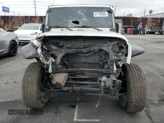 2018 Jeep Wrangler Unlimited Sport S with VIN 1C4BJWDG9JL887033, listed as a Copart auction lot 61785565 with 66,725 mi miles and Salvage title. Bid and sale history available at DreamBid. Image 5.