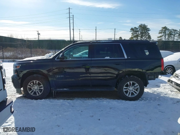 2019 Chevrolet Tahoe LT with VIN 1GNSKBKC7KR138999, listed as a IAAI auction lot 41339420 with 74,297 mi miles. Bid and sale history available at carsss.com. Image 14.