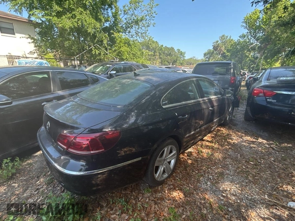 2013 Volkswagen CC Sport with VIN WVWBP7AN3DE504851, listed as a Copart auction lot 54958815 with 104,533 mi miles and Salvage Title. Bid and sale history available at carsss.com. Image 4.