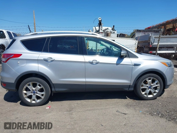 2016 Ford Escape Titanium with VIN 1FMCU9JXXGUA51537, listed as a IAAI auction lot 42118922 with 109,439 mi miles. Bid and sale history available at carsss.com. Image 13.
