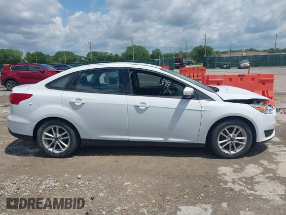 2016 Ford Focus SE z VIN 1FADP3F29GL346196, wystawiony jako IAAI lot #42171014 z przebiegiem 80 913 mil mil oraz . Historia ofert i sprzedaży dostępna na DreamBid. Obrazek 13.