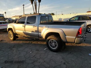 2014 Toyota Tacoma PreRunner with VIN 3TMKU4HNXEM041311, listed as a Copart auction lot 84065684 with 212,473 mi miles and Salvage title. Bid and sale history available at DreamBid. Image 2.