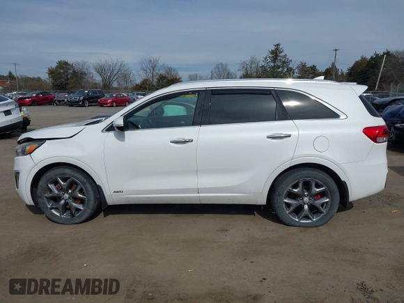 2016 Kia Sorento SX z VIN 5XYPKDA54GG101802, wystawiony jako IAAI lot #41784161 z przebiegiem 99 162 mil mil oraz . Historia ofert i sprzedaży dostępna na DreamBid. Obrazek 14.