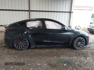 2023 Tesla Model Y Performance with VIN 7SAYGDEF2PF800641, listed as a IAAI auction lot 41612596 with 60,984 mi miles and . Bid and sale history available at DreamBid. Image 13.