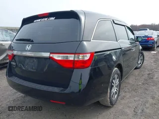 2012 Honda Odyssey EX-L with VIN 5FNRL5H63CB070361, listed as a IAAI auction lot 42025024 with 152,258 mi miles and . Bid and sale history available at carsss.com. Image 4.