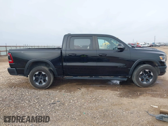 2020 Ram 1500 Rebel with VIN 1C6SRFLT5LN113514, listed as a IAAI auction lot 41718662 with 56,730 mi miles and . Bid and sale history available at DreamBid. Image 13.