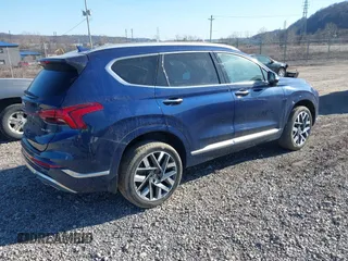 2021 Hyundai Santa Fe Calligraphy z VIN 5NMS5DAL4MH352689, wystawiony jako IAAI lot #41740911 z przebiegiem 15 589 mil mil oraz . Historia ofert i sprzedaży dostępna na DreamBid. Obrazek 4.