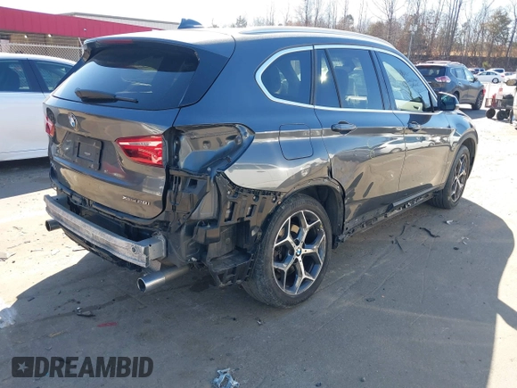 2018 BMW X1 xDrive28i z VIN WBXHT3C31J3H31737, wystawiony jako IAAI lot #41698670 z przebiegiem 68 017 mil mil oraz . Historia ofert i sprzedaży dostępna na DreamBid. Obrazek 4.