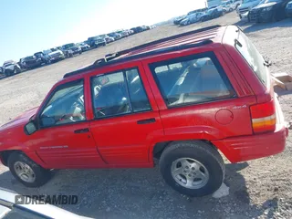 1998 Jeep Grand Cherokee Laredo with VIN 1J4GZ48Y6WC290798, listed as a IAAI auction lot 41816161 with 299,875 mi miles. Bid and sale history available at carsss.com. Image 14.