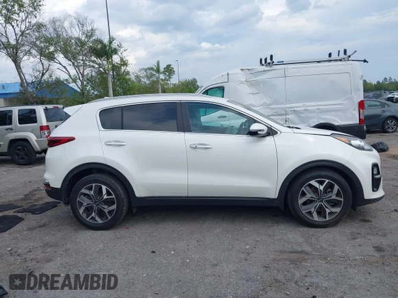 2021 Kia Sportage EX with VIN KNDPN3AC5M7856515, listed as a IAAI auction lot 41879128 with 56,537 mi miles and . Bid and sale history available at DreamBid. Image 13.