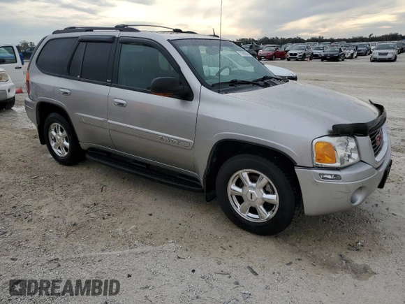 2004 GMC Envoy SLT with VIN 1GKDT13S742106035, listed as a Copart auction lot 77692884 with 122,188 mi miles and Non Repairable. Bid and sale history available at DreamBid. Image 4.