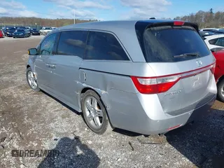 2011 Honda Odyssey Touring with VIN 5FNRL5H92BB049901, listed as a IAAI auction lot 41985224 with 101,957 mi miles and . Bid and sale history available at DreamBid. Image 3.