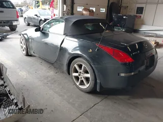 2005 Nissan 350Z Touring z VIN JN1AZ36A15M758086, wystawiony jako IAAI lot #41473598 z przebiegiem 90 799 mil mil oraz . Historia ofert i sprzedaży dostępna na DreamBid. Obrazek 3.