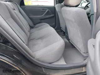 2000 Toyota Camry CE with VIN JT2BG22KXY0499280, listed as a IAAI auction lot 42075329 with 321,420 mi miles. Bid and sale history available at carsss.com. Image 8.