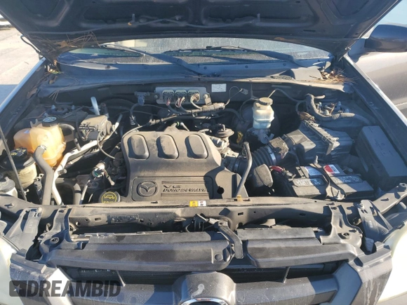 2006 Mazda Tribute S with VIN 4F2YZ04106KM28191, listed as a Copart auction lot 83150994 with 126,536 mi miles and Clean Title. Bid and sale history available at DreamBid. Image 12.