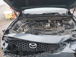 2023 Mazda CX-50 S Premium Plus z VIN 7MMVABEMXPN104518, wystawiony jako IAAI lot #42184893 z przebiegiem 61 991 mil mil oraz . Historia ofert i sprzedaży dostępna na DreamBid. Obrazek 10.