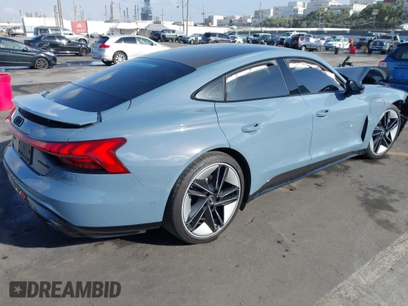 2023 Audi RS e-tron GT z VIN WAUBHBFWXP7903277, wystawiony jako IAAI lot #41098544 z przebiegiem 5781 mil mil oraz . Historia ofert i sprzedaży dostępna na DreamBid. Obrazek 4.