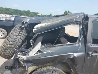 2014 Jeep Wrangler Sport with VIN 1C4AJWAGXEL233647, listed as a IAAI auction lot 39993785 with Not Provided miles and . Bid and sale history available at DreamBid. Image 12.