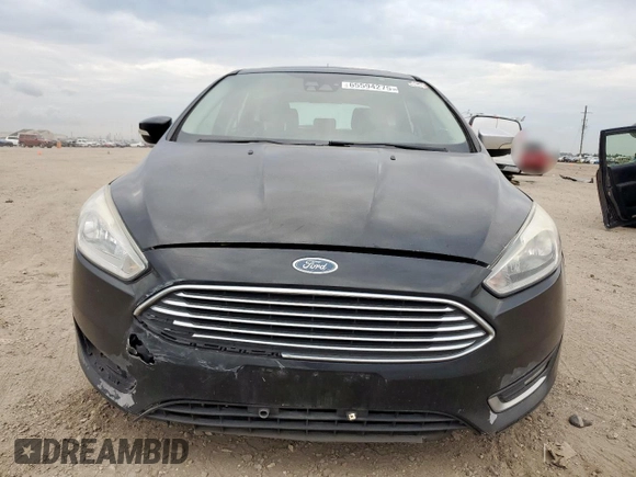 2018 Ford Focus Titanium z VIN 1FADP3N2XJL289659, wystawiony jako Copart lot #65594275 z przebiegiem 115 739 mil mil oraz Czysty tytuł • Clean title. Historia ofert i sprzedaży dostępna na DreamBid. Obrazek 5.