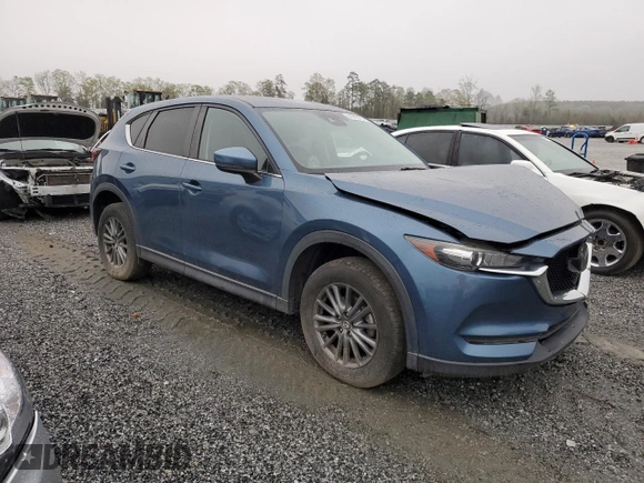 2017 Mazda CX-5 Touring with VIN JM3KFBCLXH0124451, listed as a Copart auction lot 51060275 with 126,807 mi miles and Salvage Title. Bid and sale history available at carsss.com. Image 4.