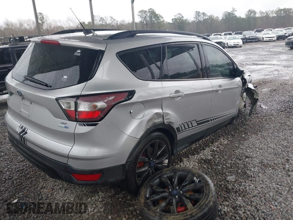 2018 Ford Escape SE z VIN 1FMCU9GD1JUB35184, wystawiony jako IAAI lot #41611285 z przebiegiem 142 267 mil mil oraz . Historia ofert i sprzedaży dostępna na DreamBid. Obrazek 4.