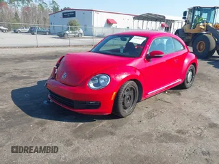 2012 Volkswagen Beetle 2.5L PZEV with VIN 3VWJP7AT0CM649068, listed as a IAAI auction lot 41684217 with 135,829 mi miles. Bid and sale history available at carsss.com. Image 2.