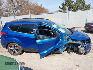 2017 Ford Escape SE z VIN 1FMCU0G95HUB75348, wystawiony jako IAAI lot #41790288 z przebiegiem 55 129 mil mil oraz . Historia ofert i sprzedaży dostępna na DreamBid. Obrazek 13.