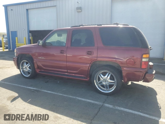 2002 GMC Yukon Denali z VIN 1GKEK63U02J118522, wystawiony jako Copart lot #52031995 z przebiegiem 166 332 mil mil oraz Szkoda całkowita • Salvage title. Historia ofert i sprzedaży dostępna na DreamBid. Obrazek 2.