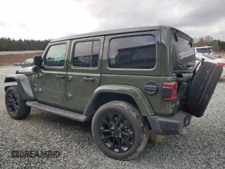 2023 Jeep Wrangler Sahara with VIN 1C4JJXP62PW553101, listed as a Copart auction lot 85543124 with 28,157 mi miles and Salvage Title. Bid and sale history available at DreamBid. Image 2.
