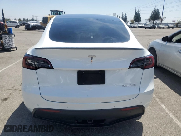 2022 Tesla Model Y Performance with VIN 7SAYGDEFXNF407340, listed as a Copart auction lot 54376895 with 56,709 mi miles and Salvage Title. Bid and sale history available at DreamBid. Image 6.