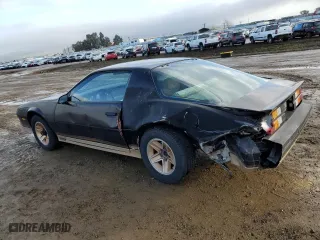 1984 Chevrolet Camaro Z28 Sport with VIN 1G1AP87G7EL175104, listed as a Copart auction lot 86895534 with 27,874 mi miles and Salvage Title. Bid and sale history available at carsss.com. Image 2.