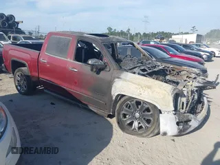 2018 GMC Sierra 1500 Denali z VIN 3GTU2PEJ5JG233035, wystawiony jako IAAI lot #42077277 z przebiegiem Nie podano mil oraz . Historia ofert i sprzedaży dostępna na DreamBid. Obrazek 1.