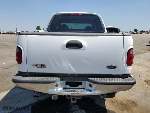 2001 Ford F-150 SuperCrew XLT with VIN 1FTRW08W41KE14810, listed as a Copart auction lot 65488844 with 185,372 mi miles and Salvage Title. Bid and sale history available at carsss.com. Image 6.