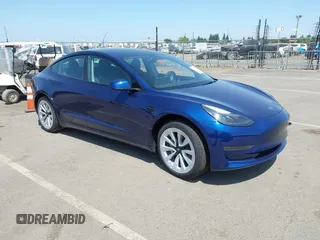 2023 Tesla Model 3 with VIN 5YJ3E1EA6PF547209, listed as a IAAI auction lot 42511077 with 6,125 mi miles and . Bid and sale history available at DreamBid. Image 1.