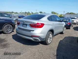 2018 BMW X6 xDrive35i z VIN 5UXKU2C51J0X50507, wystawiony jako IAAI lot #40275236 z przebiegiem 67 523 mil mil oraz . Historia ofert i sprzedaży dostępna na DreamBid. Obrazek 4.
