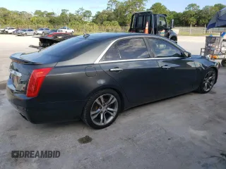 2014 Cadillac CTS Vsport Premium RWD z VIN 1G6AV5S80E0171279, wystawiony jako Copart lot #63759434 z przebiegiem 129 154 mil mil oraz Szkody całkowita. Historia ofert i sprzedaży dostępna na DreamBid. Obrazek 3.