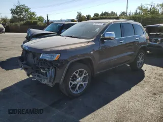 2019 Jeep Grand Cherokee Overland with VIN 1C4RJFCT7KC833390, listed as a Copart auction lot 74015774 with 64,598 mi miles and Salvage Title. Bid and sale history available at carsss.com. Image 1.