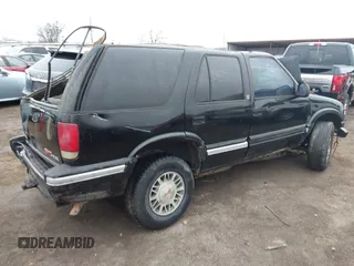 1996 GMC Jimmy SL with VIN 1GKDT13W8T2508115, listed as a IAAI auction lot 41499691 with 264,526 mi miles. Bid and sale history available at carsss.com. Image 4.