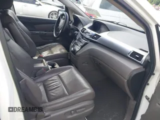 2011 Honda Odyssey Touring with VIN 5FNRL5H90BB066177, listed as a IAAI auction lot 42053368 with 239,205 mi miles and . Bid and sale history available at carsss.com. Image 5.