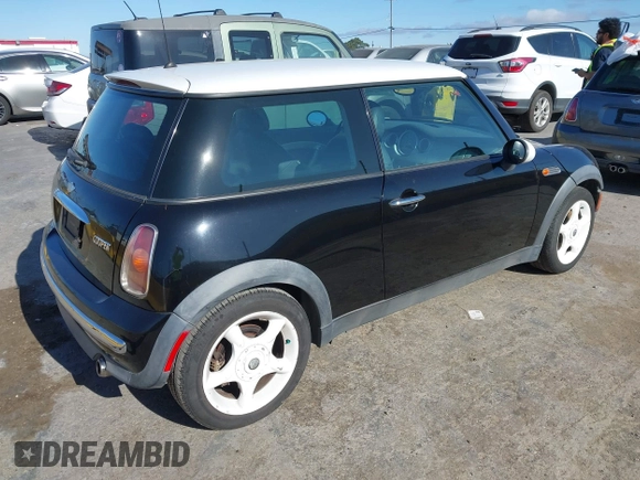 2002 MINI Hardtop with VIN WMWRC33402TC32985, listed as a IAAI auction lot 42608636 with 159,996 mi miles and . Bid and sale history available at DreamBid. Image 4.