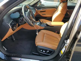 2022 BMW 5 Series M550i xDrive z VIN WBA13BK03NCK95022, wystawiony jako Copart lot #58600105 z przebiegiem 34 142 mil mil oraz Szkoda całkowita • Salvage title. Historia ofert i sprzedaży dostępna na DreamBid. Obrazek 7.
