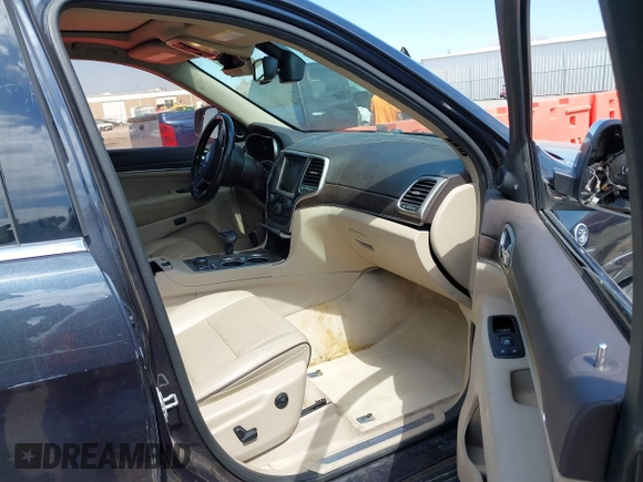 2015 Jeep Grand Cherokee Overland with VIN 1C4RJFCG6FC831641, listed as a IAAI auction lot 41877680 with 143,568 mi miles. Bid and sale history available at carsss.com. Image 5.